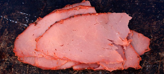 Grilled Corned Beef – St. Patrick’s Rock the Shamrock Series Pastrami on brown rustic background